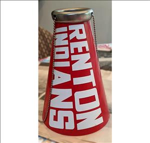A red cone with a metal chain hanging from a brass ring at the narrow end of the cone. Large white block letters on the cone say renton indians. 